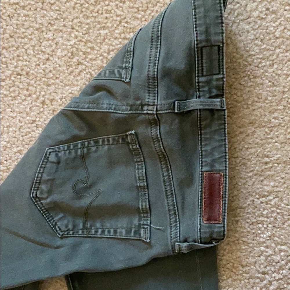 AG army green skinny jeans